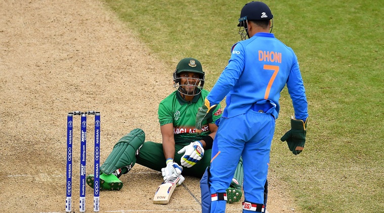 BIRMINGHAM, ENGLAND - JULY 02: Sabbir Rahman of Bangladesh slips as he bats and smiles at MS Dhoni of India during the Group Stage match of the ICC Cricket World Cup 2019 between Bangladesh and India at Edgbaston on July 02, 2019 in Birmingham, England. (Photo by Clive Mason/Getty Images)