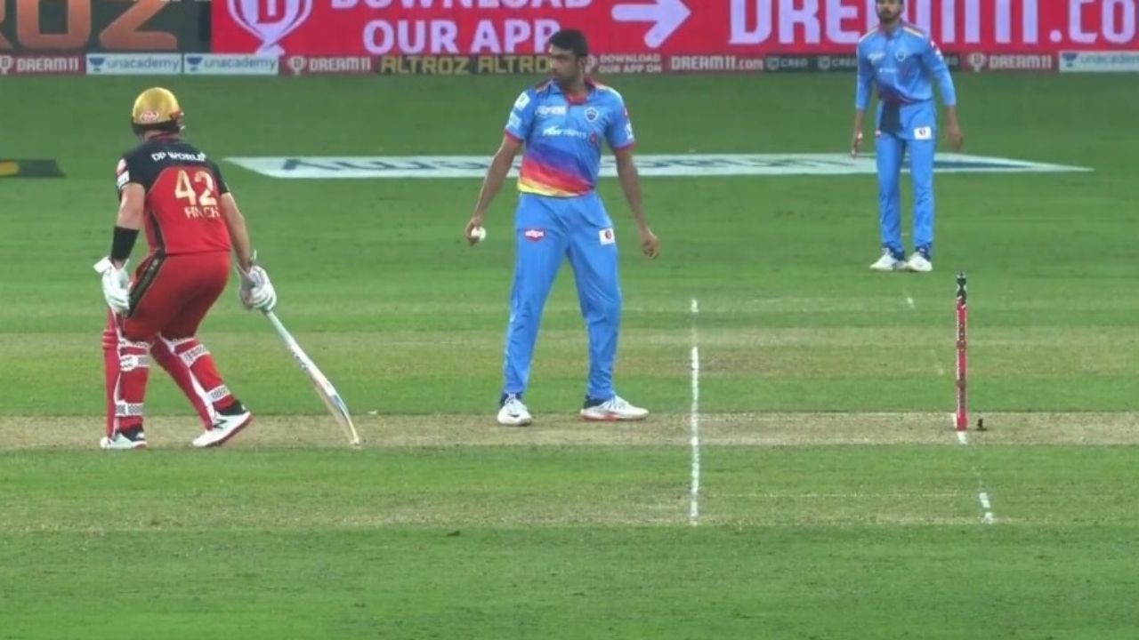Finch gets a warning from Ravichandran Ashwin as he tries to leave his crease