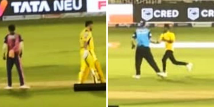 A fan attempted to meet MS Dhoni as he dodged the security in the stadium and entered the field to meet his idol. Umpire becomes obstacle