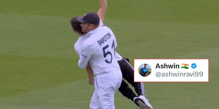 Jonny Bairstow carries the protester